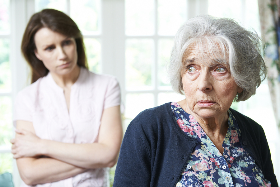 Serious Senior Woman With Adult Daughter At Home